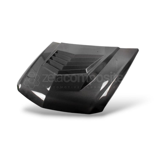 Carbon fiber hood showing vent recesses and textured air channels