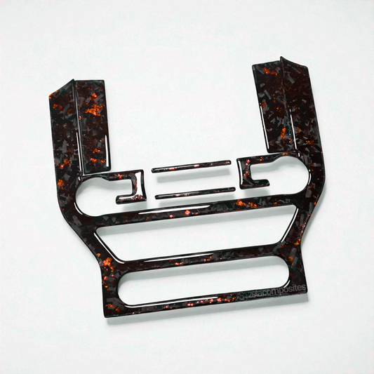 Carbon fiber radio overlay trim with orange flecks, molded for center console controls