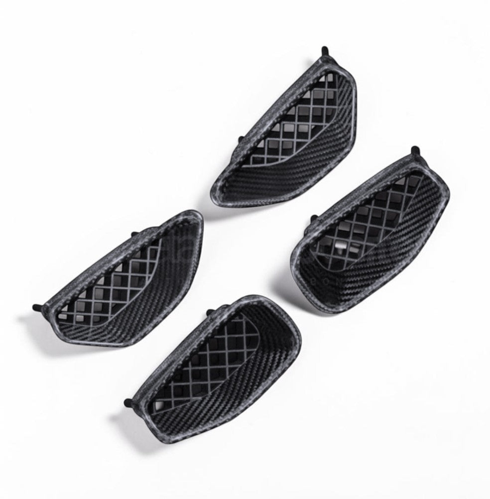 Four black carbon fiber mesh grille inserts arranged on a white background, showing a textured woven pattern.