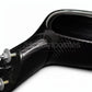 A close-up of a glossy black carbon fiber automotive part, showing the woven carbon fiber pattern and a silver metal bolt fastener, on a white background.