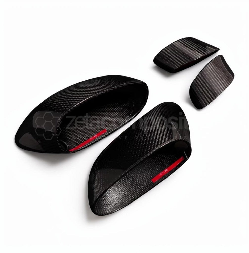 Four black carbon fiber textured trim pieces with red inner lining, arranged on a white background.