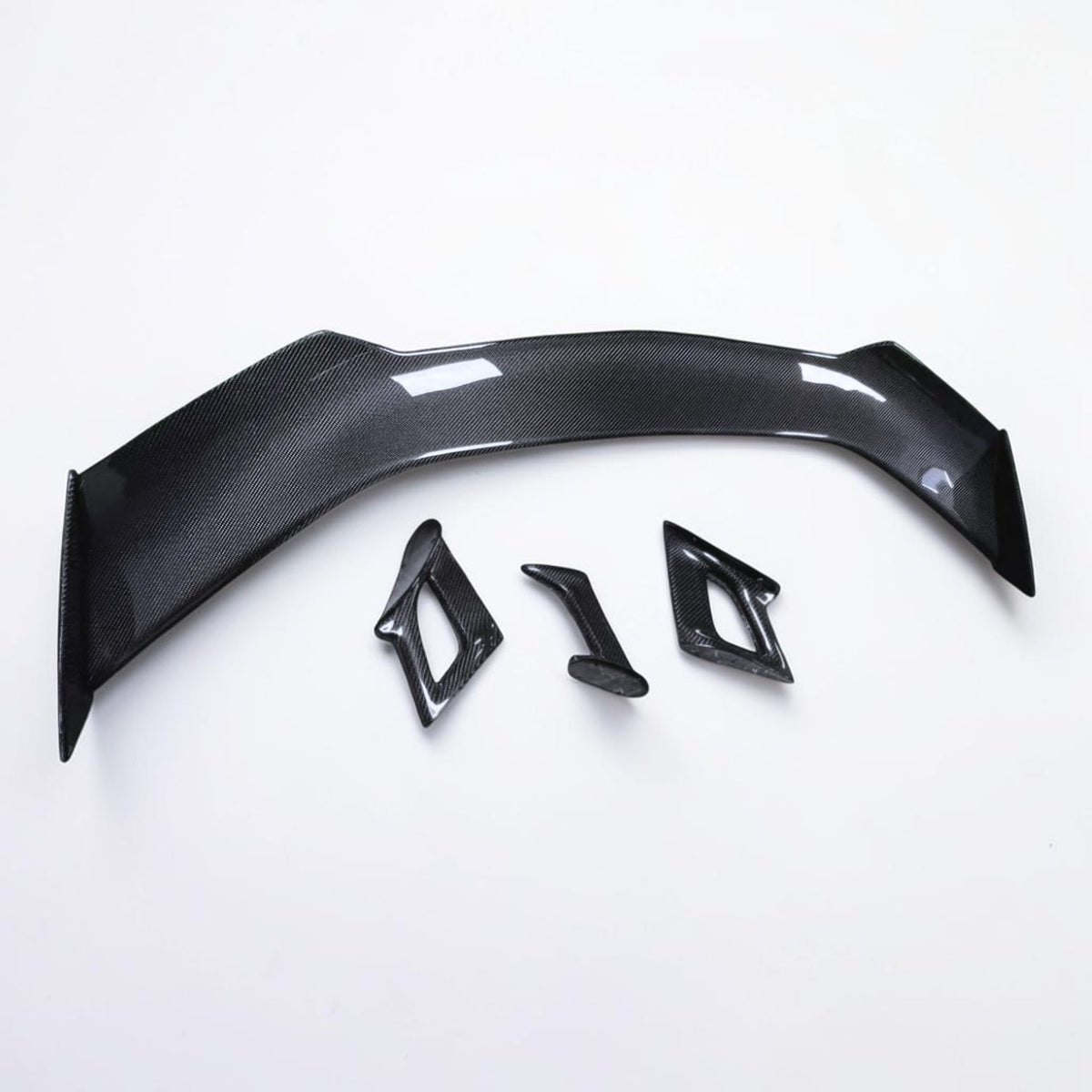 Black carbon fiber rear spoiler with mounting hardware, curved profile
