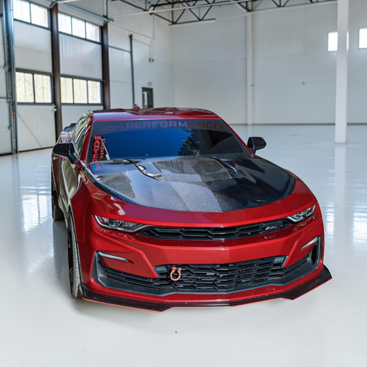 red 6th gen camaro with carbon fiber hood