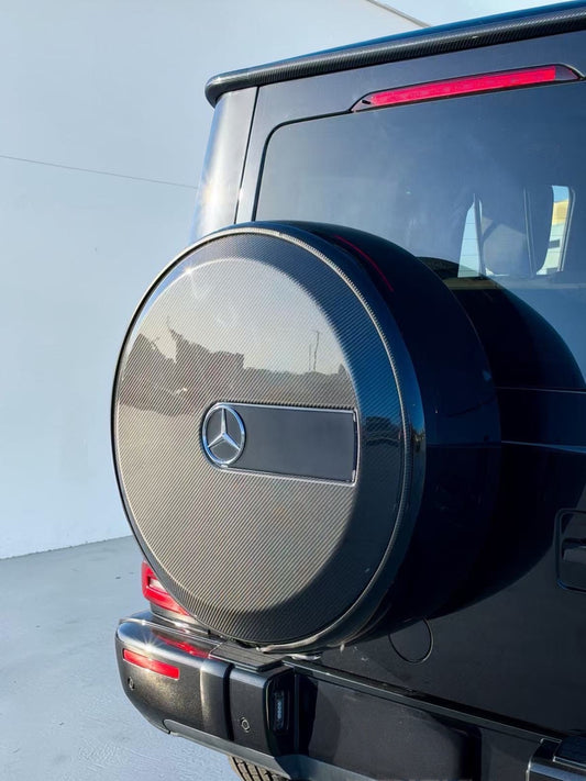 Mercedes spare tire cover, round dry carbon fiber cap on rear of the G-Class