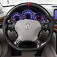 Acura carbon fiber steering wheel with Acura logo, red stripe, and multi-button controls