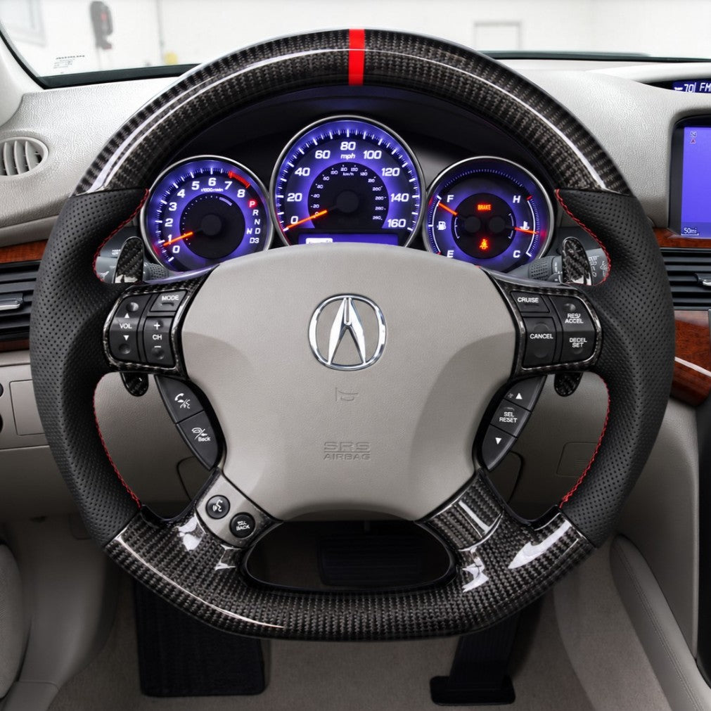Acura carbon fiber steering wheel with Acura logo, red stripe, and multi-button controls