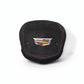 A black suede cover featuring red contrast stitching and a silver Cadillac crest emblem in the center, set against a plain white background.