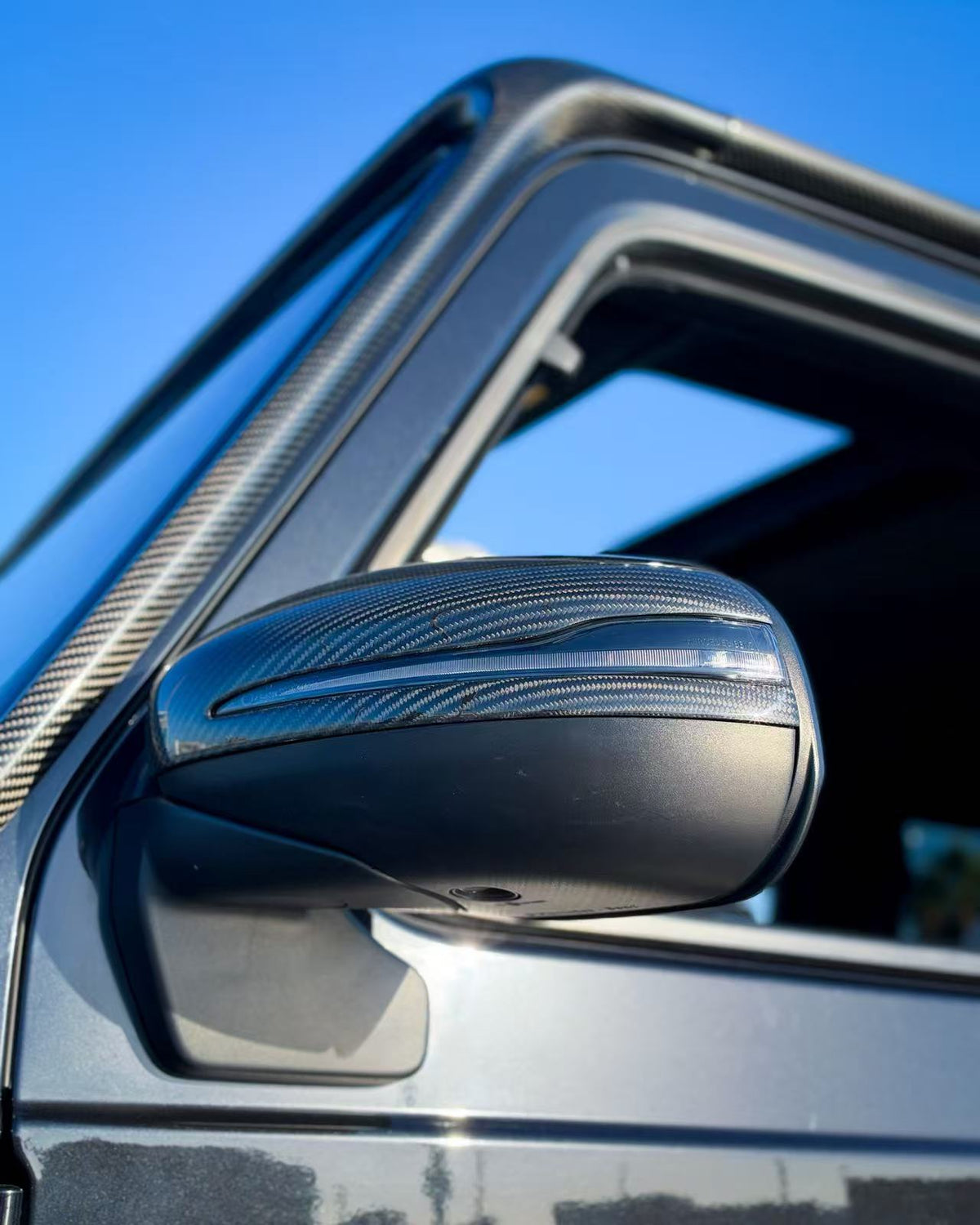 Mercedes G-Class carbon fiber mirror cap cover, installed on driver-side mirror