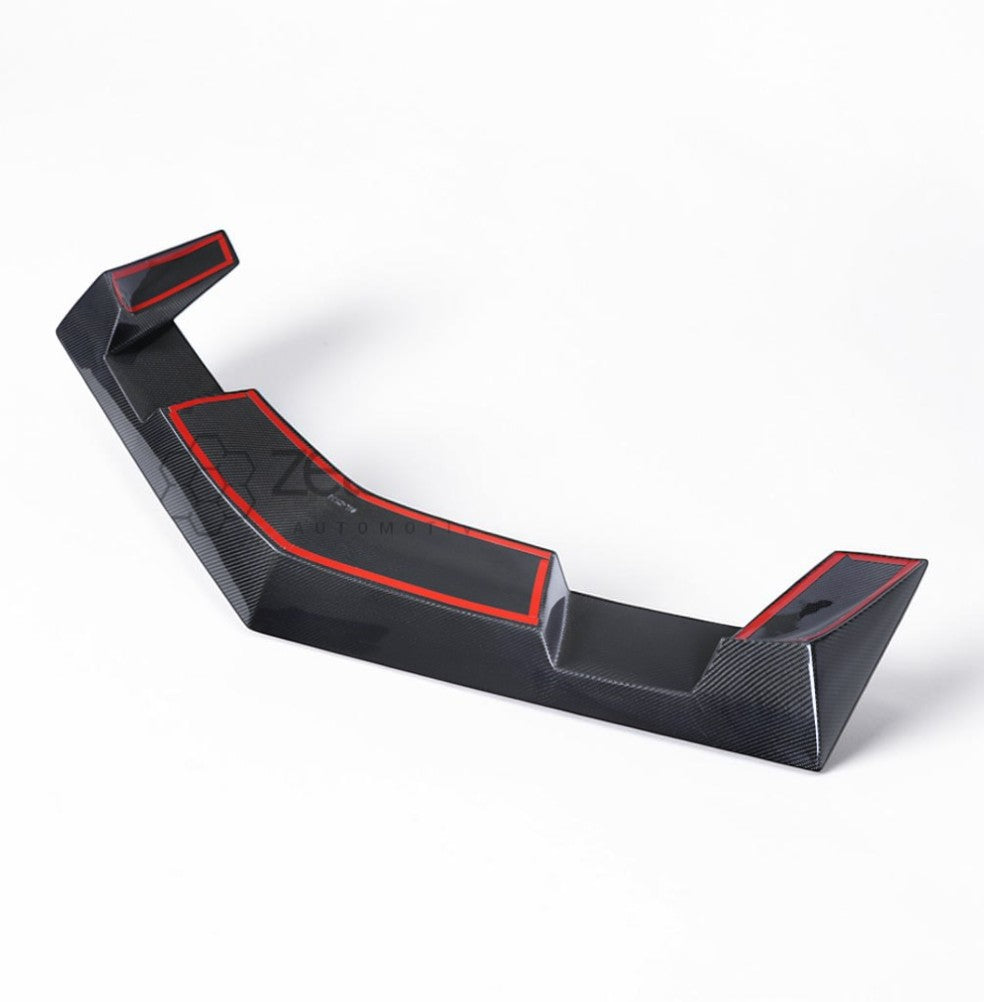 A black carbon fiber automotive spoiler with red accent lines, shown on a clean white background.