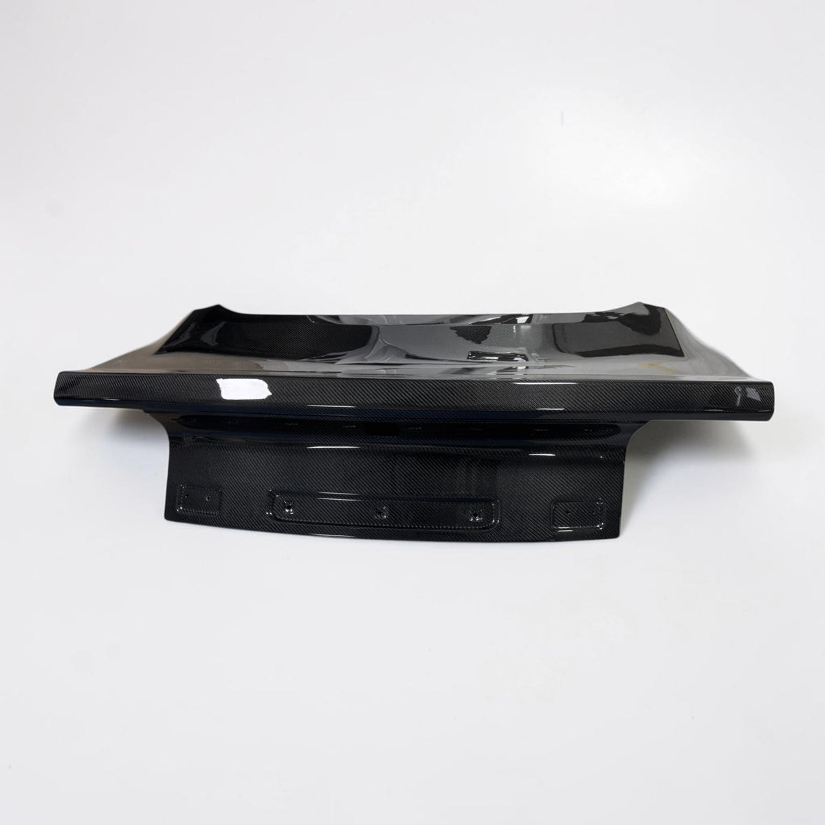 OEM-style Mustang carbon fiber trunk lid, black glossy weave with mounting panel