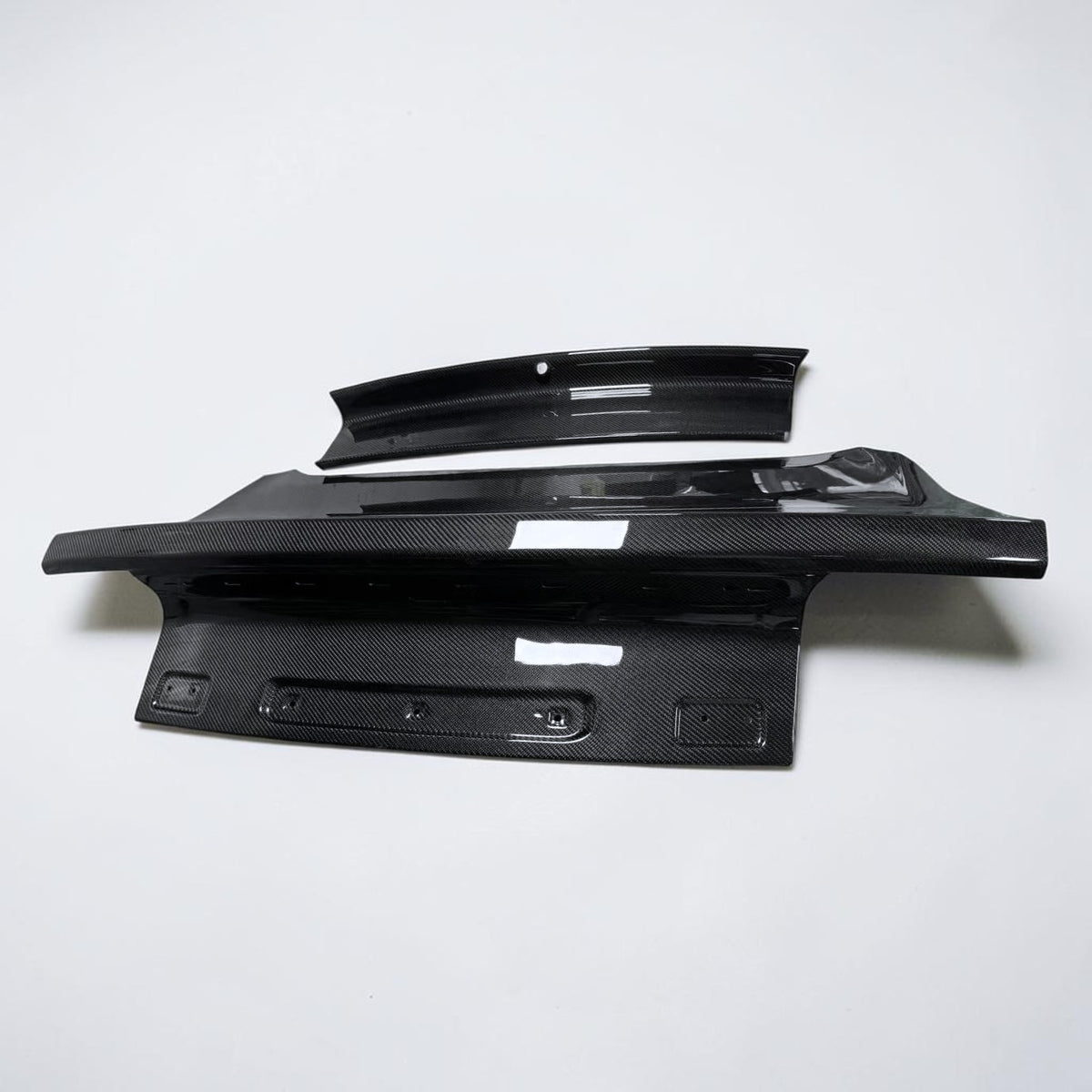 OEM-style carbon fiber trunk lid, black weave finish with mounting holes and slots